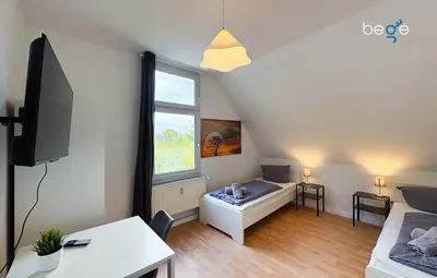 Ein Bett oder Betten in einem Zimmer der Unterkunft BEGE APARTMENTS WorkSuite