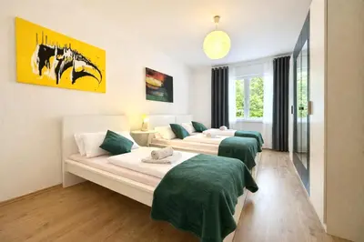 Ein Bett oder Betten in einem Zimmer der Unterkunft VAJAGIC 1 - Apartment 4 Pers, 60 qm, EG, Messe, Uni Klinik