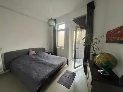 Ein Bett oder Betten in einem Zimmer der Unterkunft Central Urban Experience parking included