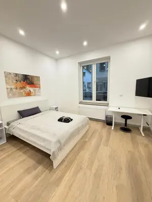 Ein Bett oder Betten in einem Zimmer der Unterkunft Exklusives City-Zimmer, Gemeinschaftsbad und Küche