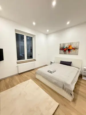Ein Bett oder Betten in einem Zimmer der Unterkunft Exklusives City-Zimmer, Gemeinschaftsbad und Küche