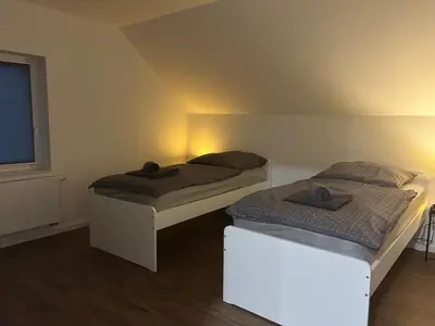 Ein Bett oder Betten in einem Zimmer der Unterkunft SleepInn Recklinghausen