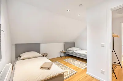 Ein Bett oder Betten in einem Zimmer der Unterkunft Zentral gelegen in Haan - 4 Schlafzimmer- Bis zu 7 Personen