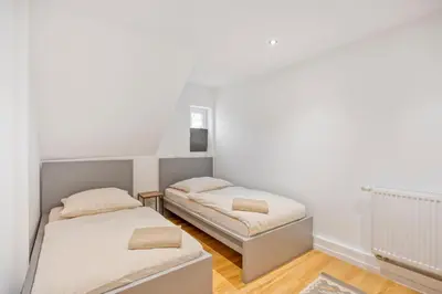 Ein Bett oder Betten in einem Zimmer der Unterkunft Zentral gelegen in Haan - 4 Schlafzimmer- Bis zu 7 Personen