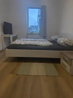 Ein Bett oder Betten in einem Zimmer der Unterkunft Wupper Apartments Vogel