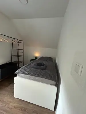 Ein Bett oder Betten in einem Zimmer der Unterkunft CityNest Recklinghausen