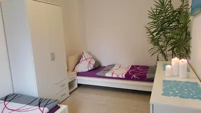 Ein Bett oder Betten in einem Zimmer der Unterkunft Holiday Apartment Essen