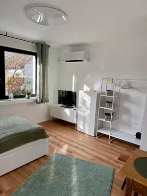 Ein Bett oder Betten in einem Zimmer der Unterkunft Grüne Oase in Stadtnähe
