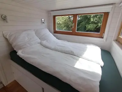 Ein Bett oder Betten in einem Zimmer der Unterkunft Tiny house with view of nature