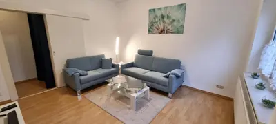 Ein Sitzbereich in der Unterkunft Charmante, ruhige Erdgeschosswohnung mit Balkon