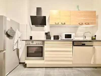 Küche/Küchenzeile in der Unterkunft Stylish City Apartment mit Beamer & Balkon Zentral