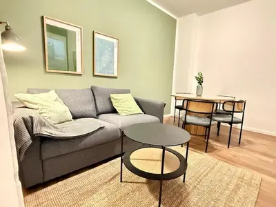 Ein Sitzbereich in der Unterkunft Stylish City Apartment mit Beamer & Balkon Zentral