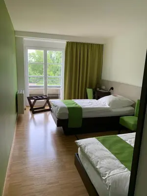 Ein Bett oder Betten in einem Zimmer der Unterkunft Tagungshotel Haus Villigst
