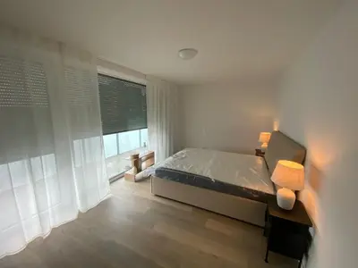 Ein Bett oder Betten in einem Zimmer der Unterkunft Quartiercenter Gäste-Apartment