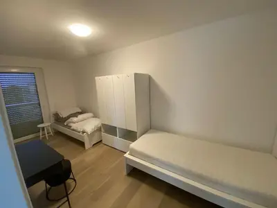 Ein Bett oder Betten in einem Zimmer der Unterkunft Quartiercenter Gäste-Apartment