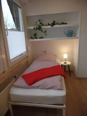 Ein Bett oder Betten in einem Zimmer der Unterkunft Gemütliche Dachgeschoss Wohnung