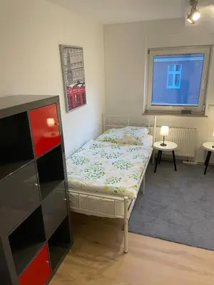 Ein Bett oder Betten in einem Zimmer der Unterkunft Gemütliche Dachgeschoss Wohnung
