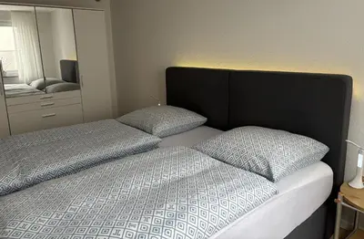 Ein Bett oder Betten in einem Zimmer der Unterkunft WohlfühlQuartier Hückeswagen