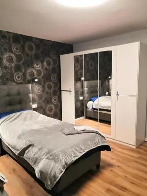 Ein Bett oder Betten in einem Zimmer der Unterkunft Schöne Ferienwohnung in Schwerte Central