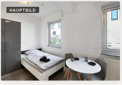 Ein Bett oder Betten in einem Zimmer der Unterkunft StayBaran City Apartment Bochum
