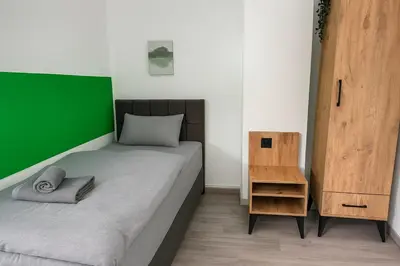 Ein Bett oder Betten in einem Zimmer der Unterkunft Livemore24 Apartment 1 in Herten 24-7 Check-In