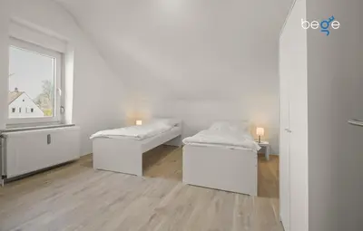 Ein Bett oder Betten in einem Zimmer der Unterkunft BEGE APARTMENTS WorkFlow