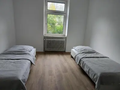 Ein Bett oder Betten in einem Zimmer der Unterkunft LivingStation Essen R1 bis R4