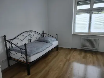 Ein Bett oder Betten in einem Zimmer der Unterkunft LivingStation Essen R1 bis R4