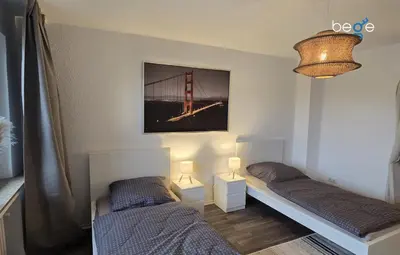 Ein Bett oder Betten in einem Zimmer der Unterkunft BEGE APARTMENTS WorkHaus