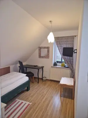Ein Bett oder Betten in einem Zimmer der Unterkunft Hotel Haus Niggemann