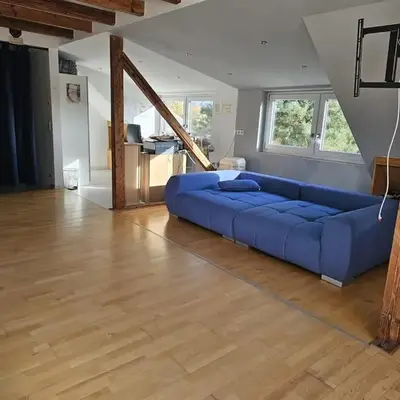Stylish top floor apartment with garden view