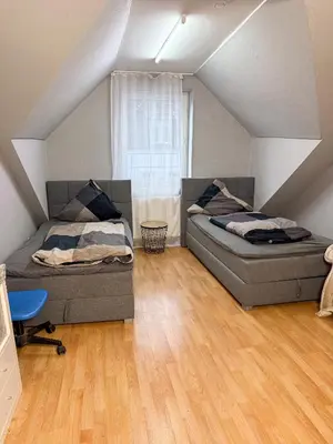 Ein Bett oder Betten in einem Zimmer der Unterkunft Ruhr Business Apartments Essen Apartment mit 7 Einzelbetten