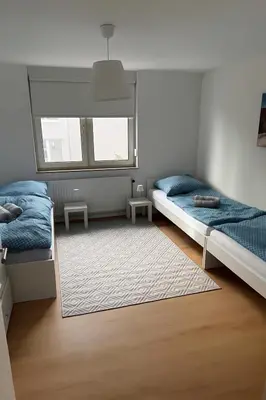 Ein Bett oder Betten in einem Zimmer der Unterkunft Stylish 4-Person CityNest Wuppertal Near Hbf