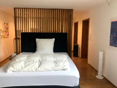 Ein Bett oder Betten in einem Zimmer der Unterkunft Messe Premium Apartment