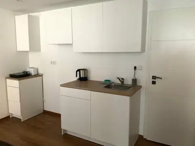 Küche/Küchenzeile in der Unterkunft Messe Premium Apartment