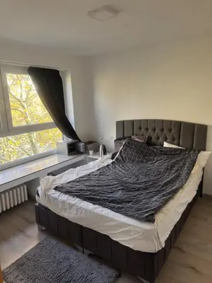 Ein Bett oder Betten in einem Zimmer der Unterkunft Große Wohnung am HBF-Vorplatz