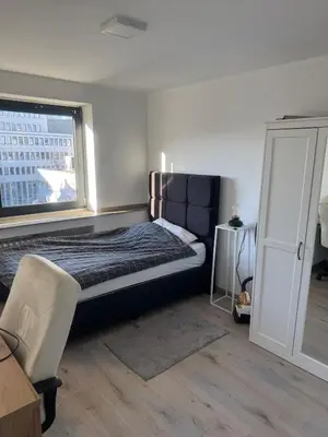 Ein Bett oder Betten in einem Zimmer der Unterkunft Große Wohnung am HBF-Vorplatz