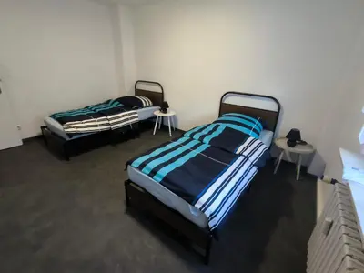 Ein Bett oder Betten in einem Zimmer der Unterkunft Mego Unterkünfte 2