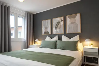 Ein Bett oder Betten in einem Zimmer der Unterkunft Großzügiges Apartment am Limbecker Platz mit Cafés, Top Anbindung & Netflix