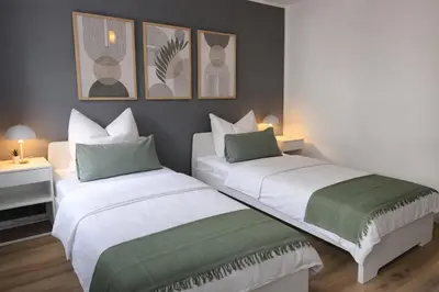 Ein Bett oder Betten in einem Zimmer der Unterkunft Großzügiges Apartment am Limbecker Platz mit Cafés, Top Anbindung & Netflix