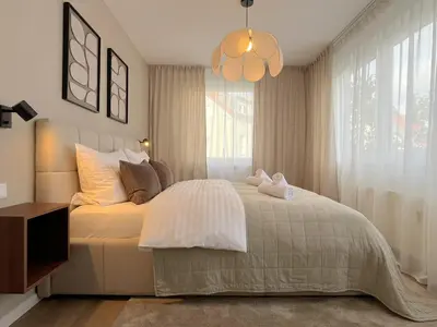 Ein Bett oder Betten in einem Zimmer der Unterkunft Seestadt Apartment I Sauna I Parkplatz I Zentral