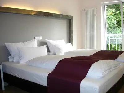 Ein Bett oder Betten in einem Zimmer der Unterkunft Apartment in Oberhausen near Scenic Lake