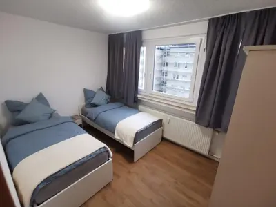 Ein Bett oder Betten in einem Zimmer der Unterkunft Home 18 - Monteurwohnung für 8 Personen
