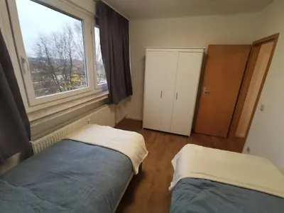 Ein Bett oder Betten in einem Zimmer der Unterkunft Home 18 - Monteurwohnung für 8 Personen