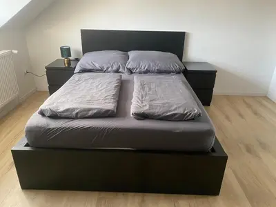 Ein Bett oder Betten in einem Zimmer der Unterkunft Minos Unterkunft