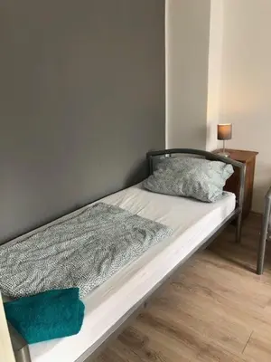 Ein Bett oder Betten in einem Zimmer der Unterkunft Big House in Duisburg - maximal 6 Persons with Garden