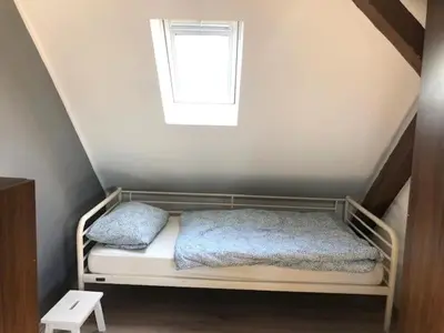 Ein Bett oder Betten in einem Zimmer der Unterkunft Big House in Duisburg - maximal 6 Persons with Garden