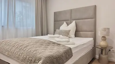 Ein Bett oder Betten in einem Zimmer der Unterkunft Ideale City-Wohnung mit 2 Schlafzimmern & Parking