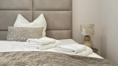 Ein Bett oder Betten in einem Zimmer der Unterkunft Ideale City-Wohnung mit 2 Schlafzimmern & Parking
