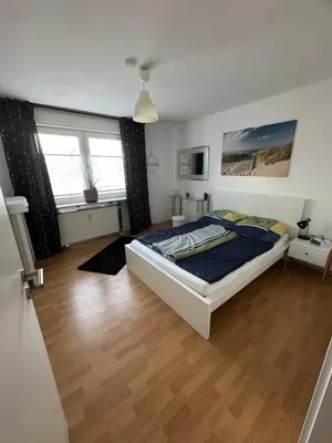 Ein Bett oder Betten in einem Zimmer der Unterkunft Wolke13 - gemütliche 2 Zimmer Wohnung mit voll ausgestatteter Küche in der City von Menden